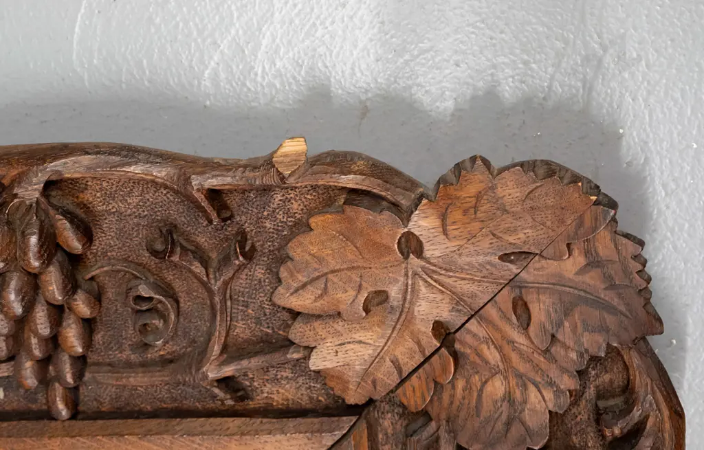 vintage carved oak-framed bevelled edge mirror profusely carved with grape and leaf motifs, chips and a small Image 1++