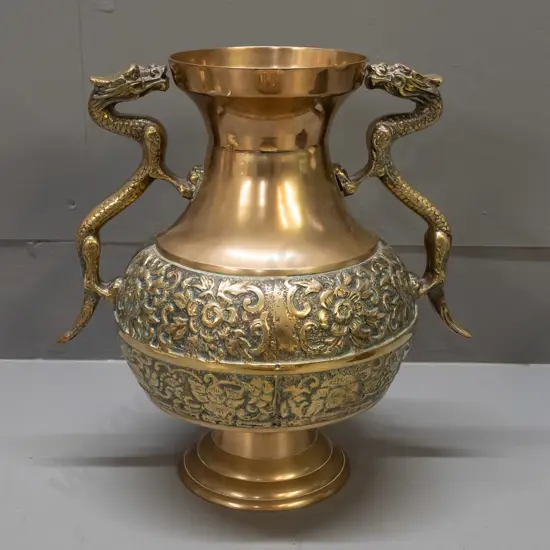 brass vase with band of cast decoration and cast dragon handles - minor pitting to cast areas H-290 W-250 across handles