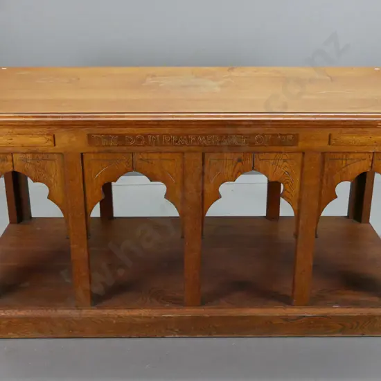 vintage oak altar table with gothic arch decoration on platform base, square section legs, etched and gilded motto in