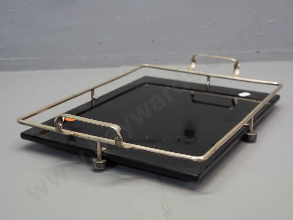 art deco black glass or vitrolite tray with plated gallery and handles, ridged texture on underside, on plated ball feet Image 1++