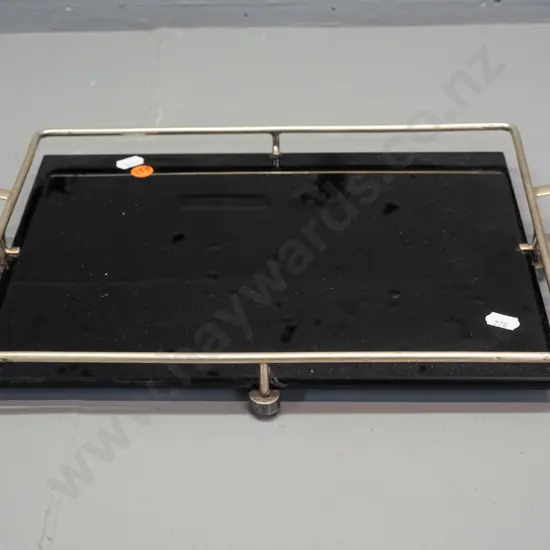 art deco black glass or vitrolite tray with plated gallery and handles, ridged texture on underside, on plated ball feet