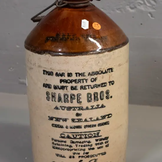 Sharpe Brothers Australia and New Zealand stoneware crock with Bendigo Potteries manufacturer's mark, threaded wooden