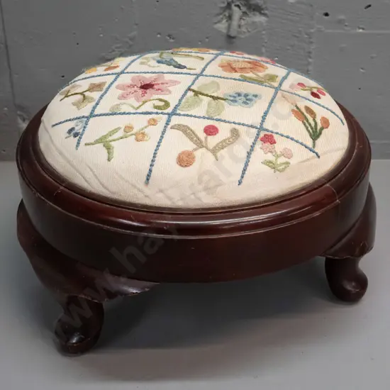 vintage mahogany low circular foot stool on short cab legs - some staining to floral embroidered fabric, minor scuffing