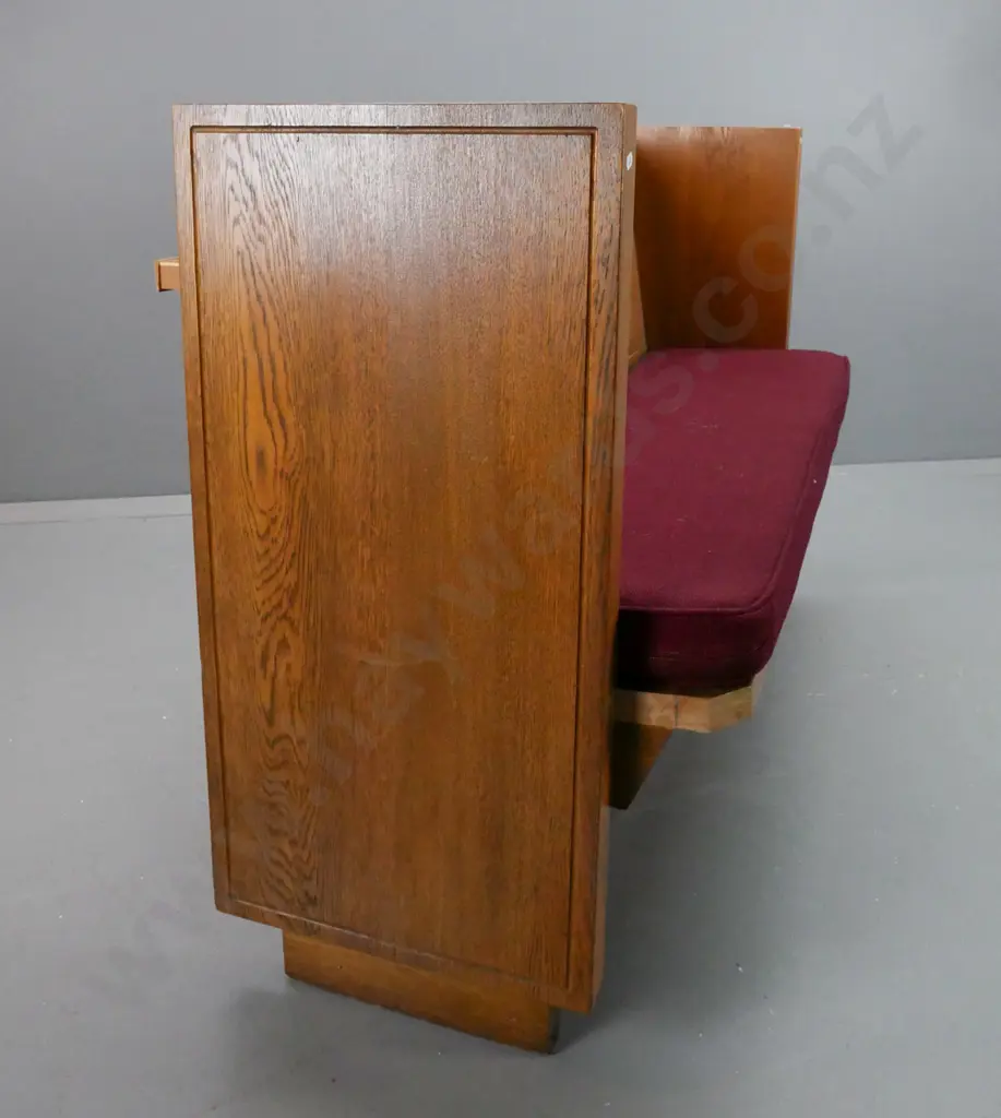 compact (3 seat?) oak church pew with maroon upholstered squab, metal floor mounting brackets. Some splintering at one Image 1++