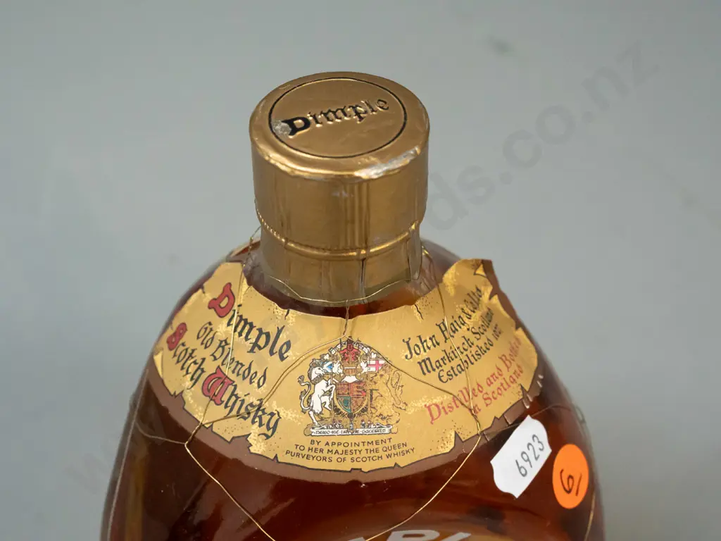 vintage bottle of John Haig & Co "Dimple" scotch whisky - dimpled bottle with mesh cover - 1 pint 6 ounce (approx 700ml) Image 1++