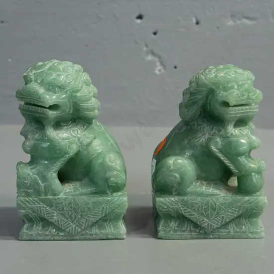 2 small Chinese carved green stone temple lions - some light chipping & wear H-100 L-70