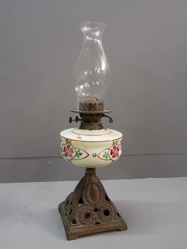 vintage kerosene lamp with hand painted uranium glass tank on cast metal base, globe logo on adjustment knobs H-555 Image 1++