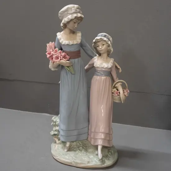 Lladro figurine - two girls with flowers, small chip to one pink flower petal H-330