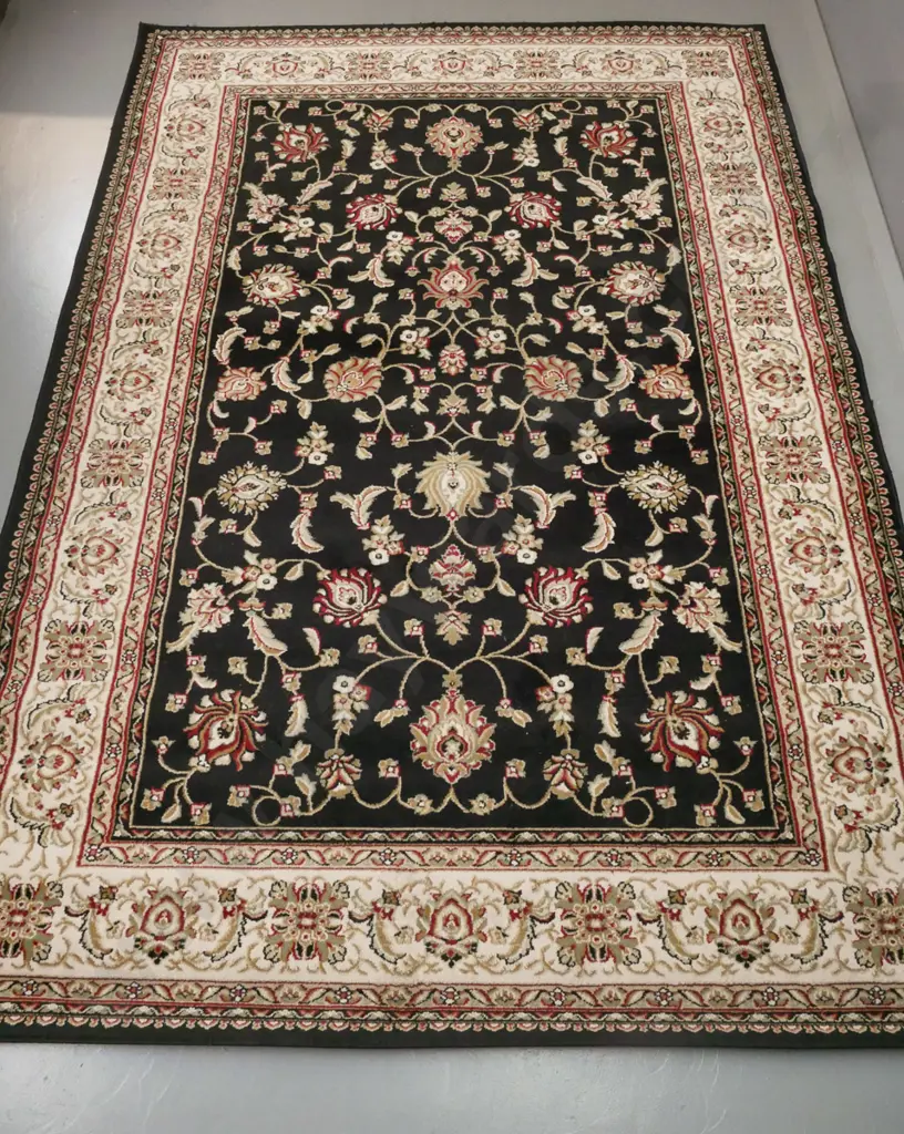 "Nazreen" Indonesian machine woven floor rug in black, red and browns, foliate motifs L-2900 W-2000 Image 1++
