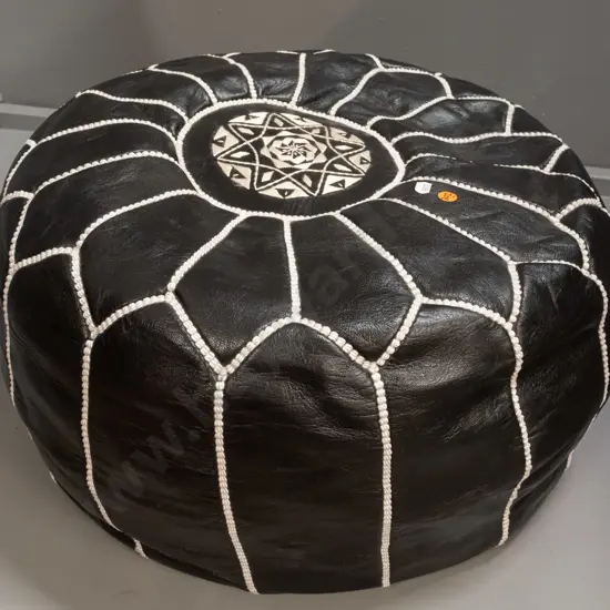 black leather pouffe with geometric white rope-effect stitching - a little minor flaking to leather on bottom edge H-290
