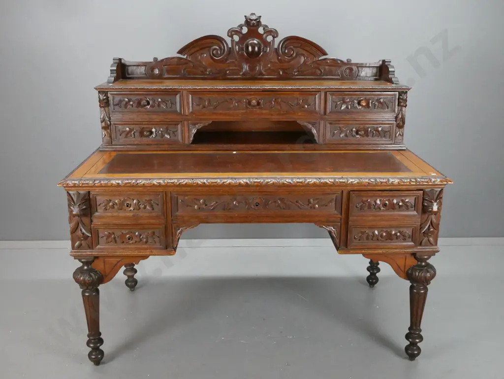 antique French 1870s oak desk with carved lion's head crest and corbels, 5 drawer bank in top, slide-out writing surface Image 1++