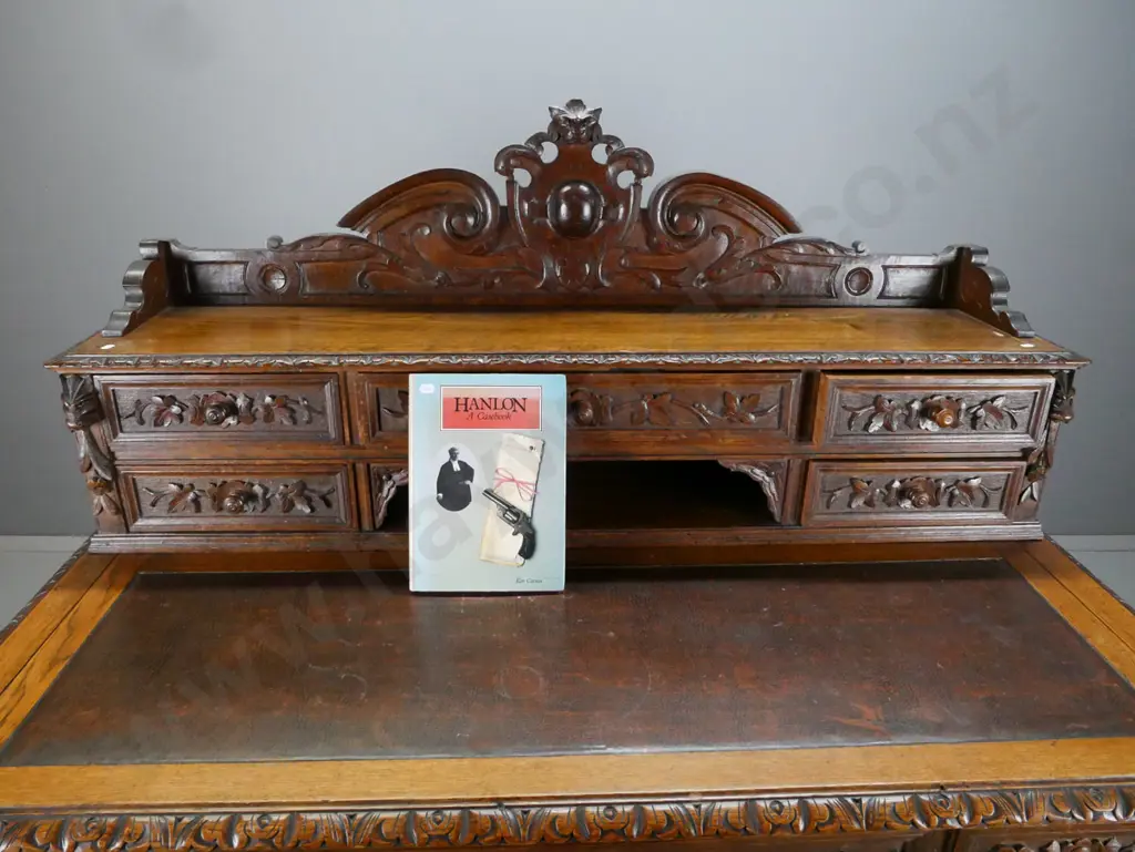 antique French 1870s oak desk with carved lion's head crest and corbels, 5 drawer bank in top, slide-out writing surface Image 1++