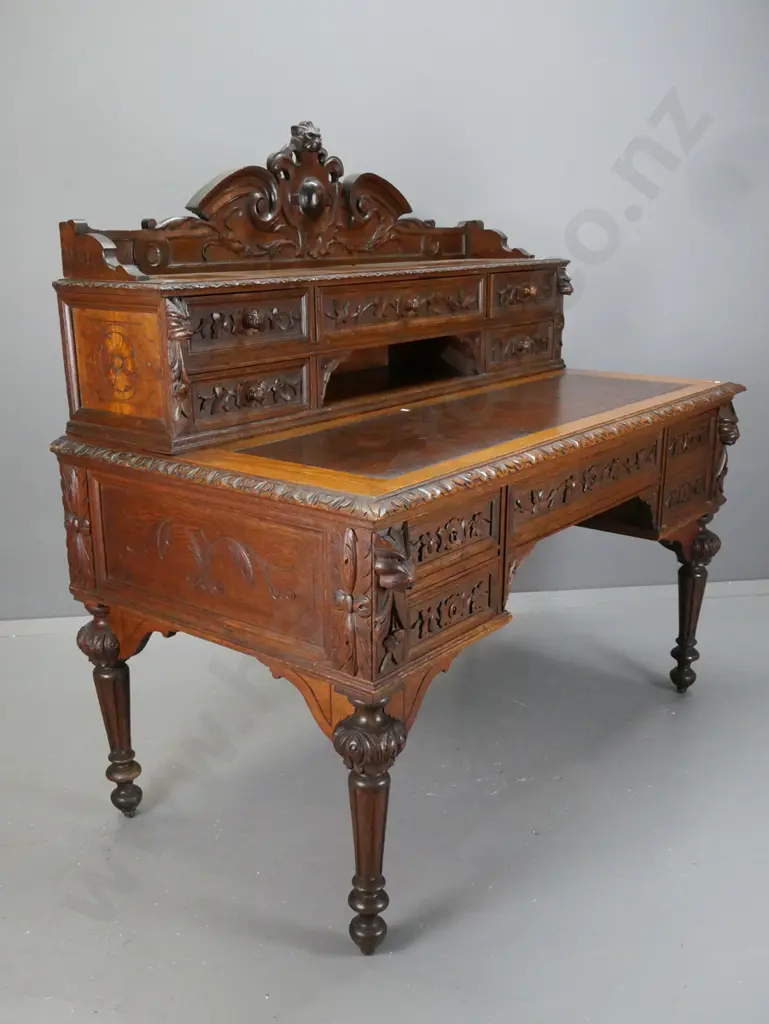 antique French 1870s oak desk with carved lion's head crest and corbels, 5 drawer bank in top, slide-out writing surface Image 1++