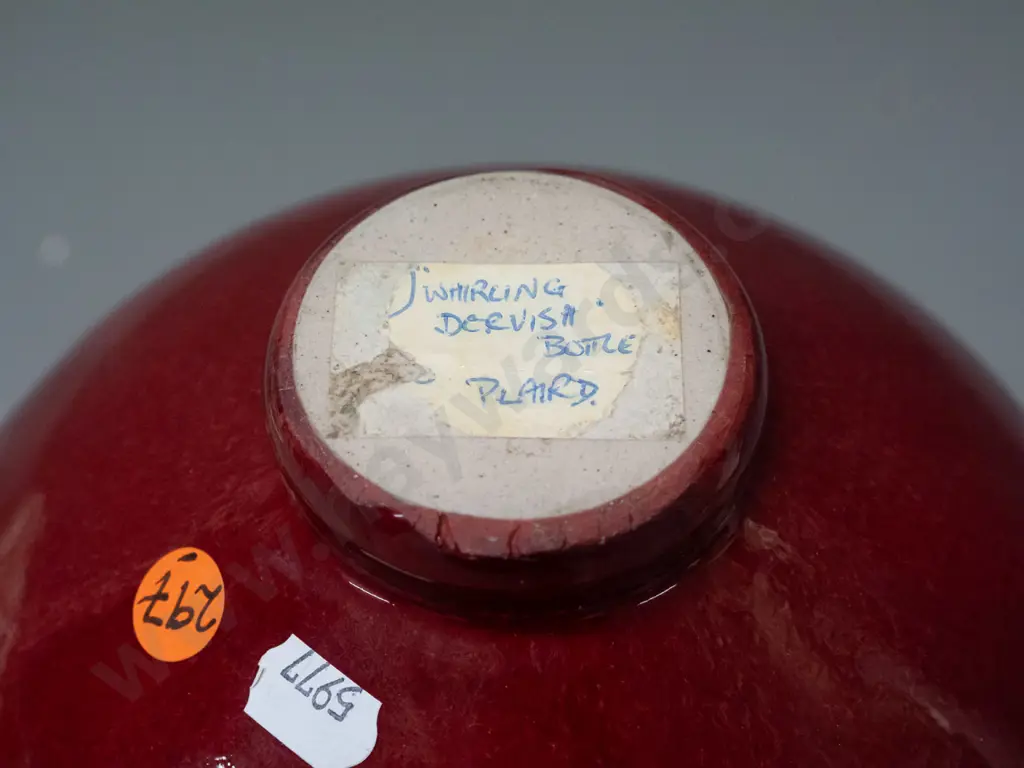 Paul Laird New Zealand studio pottery bottle vase - gilt decoration over dark red, label marked Whirling Dervish Bottle Image 1++