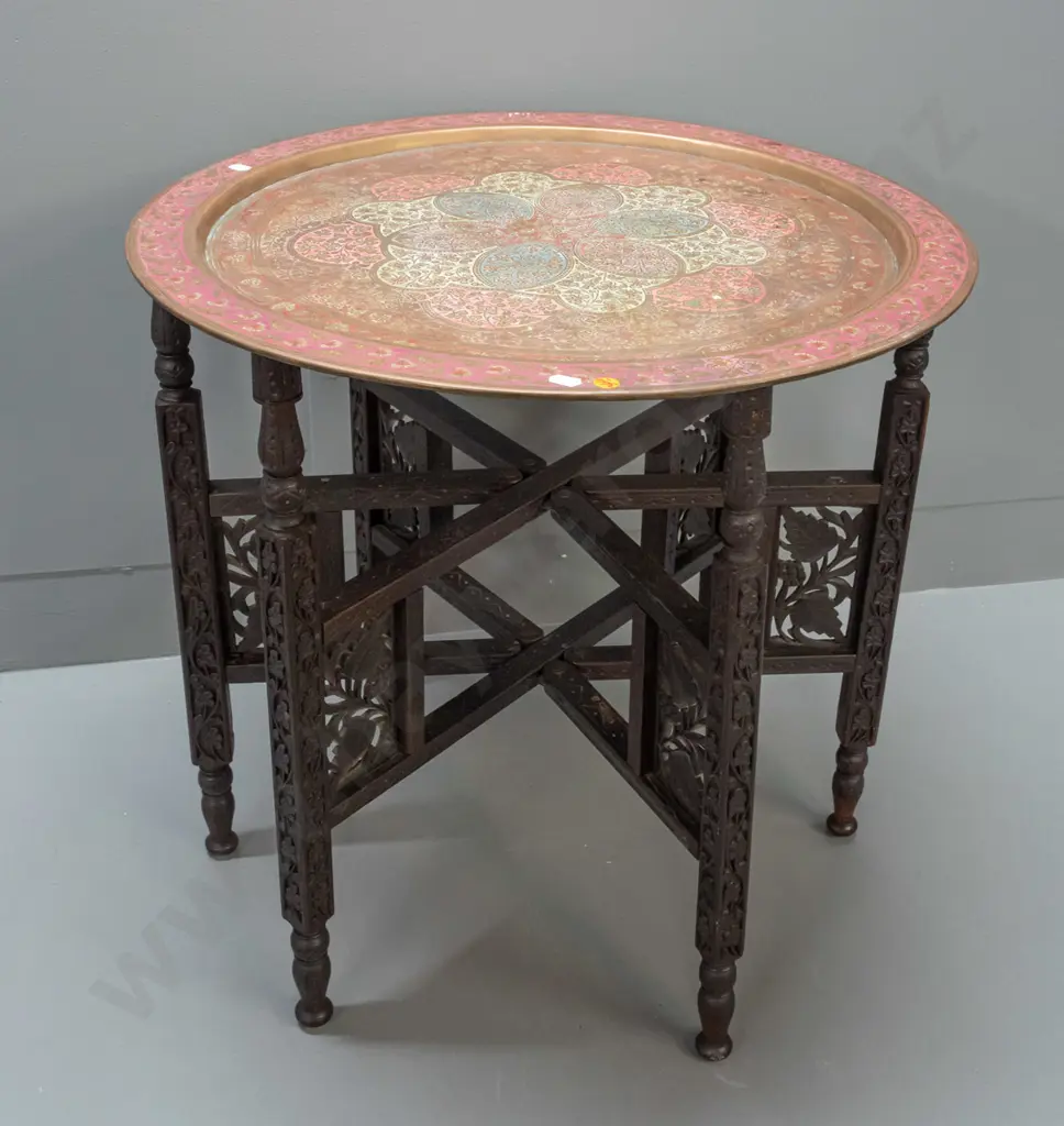brass tray table with folding 6-legged hardwood base - hinged legs with carved and pierced decoration, etched brass tray Image 1++