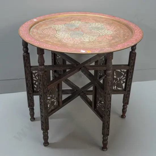 brass tray table with folding 6-legged hardwood base - hinged legs with carved and pierced decoration, etched brass tray