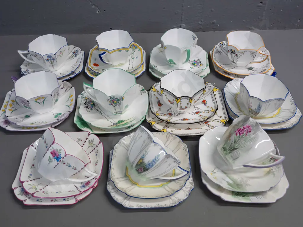 group of Shelley deco-style trios in different patterns & colours, matching scalloped facet-sided cup shape Image 1++
