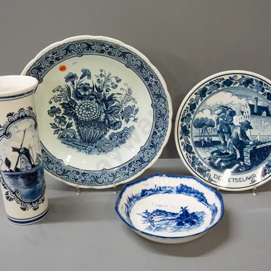 4 pieces blue and white ware - 3 Delft, one Doulton Norfolk - 2 Delft plates with wall hangers on back, tall cylindrical