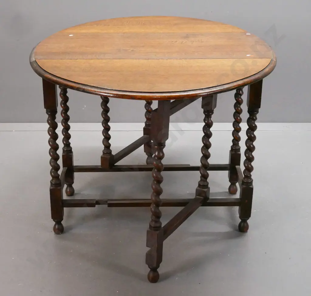 vintage oak oval gate-leg table w/ jacobean twist leg supports, rectangular refectory-style base on bobbin-tuned feet. Image 1++