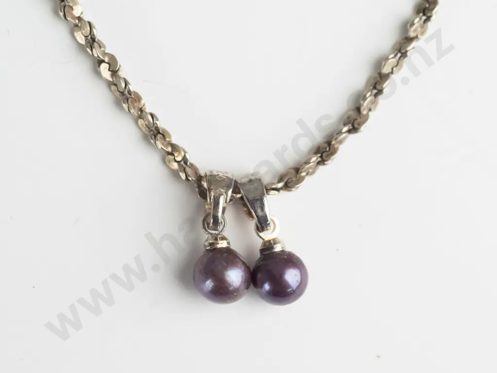 silver bracelet with 2 purple balls stamped 925 Image 1++
