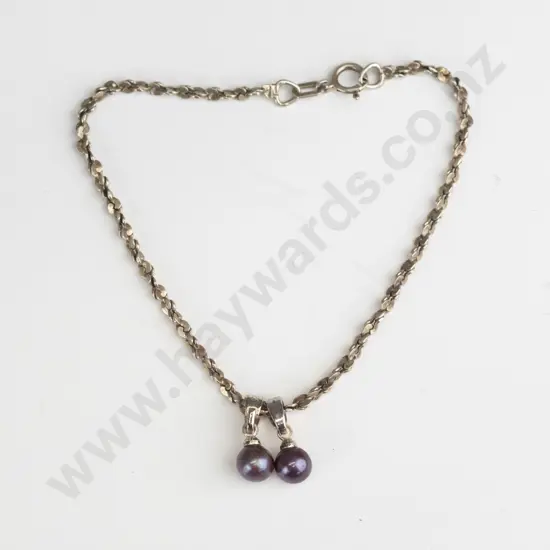 silver bracelet with 2 purple balls stamped 925