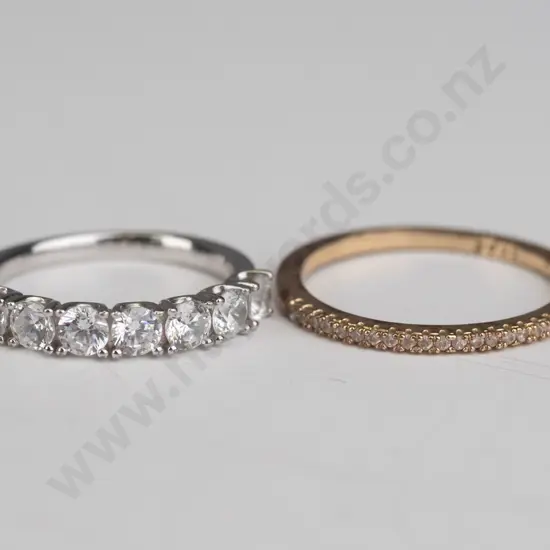 2 silver cz rings both stamped 925