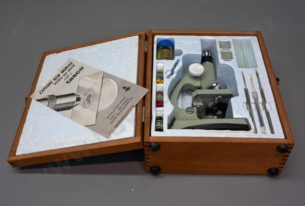 1960s Tasco Zoom 900x microscope set in hinged wooden case, with dyes, crab specimen, tweezers, slides & booklet. Case Image 1++