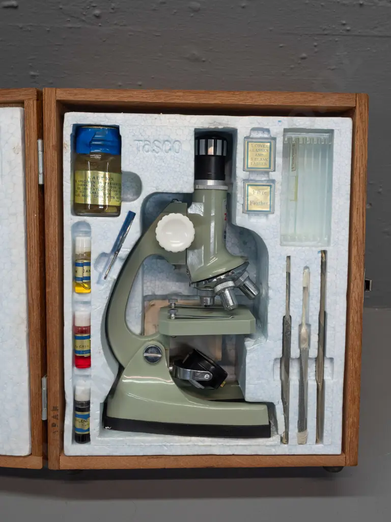 1960s Tasco Zoom 900x microscope set in hinged wooden case, with dyes, crab specimen, tweezers, slides & booklet. Case Image 1++