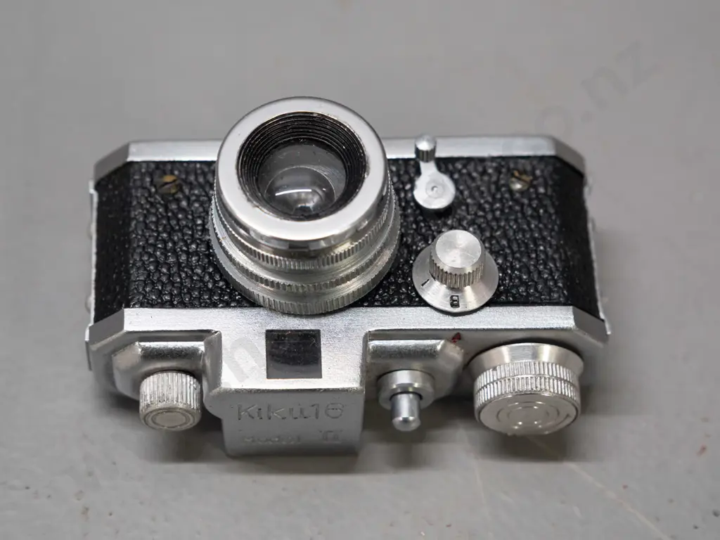 vintage Japanese "Kiku 16 Model II" miniature camera with leather case. Has take-up spool, shutter fires intermittently, Image 1++