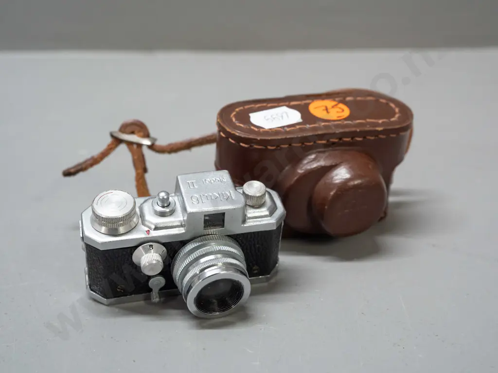 vintage Japanese "Kiku 16 Model II" miniature camera with leather case. Has take-up spool, shutter fires intermittently, Image 1++
