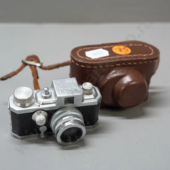 vintage Japanese "Kiku 16 Model II" miniature camera with leather case. Has take-up spool, shutter fires intermittently,