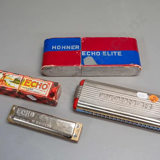 2 vintage Hohner harmonicas in cardboard boxes - large German Echo Elite L-180 W-60 and smaller English Echo - end piece