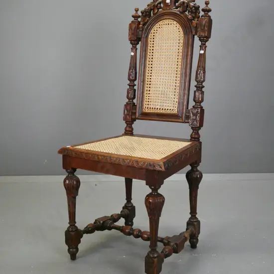 Victorian oak Jacobean style chair with shaped carved back, turned & fluted back supports and legs, on turned stretcher