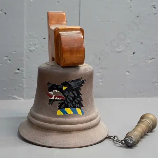 Cast metal wall-mount school bell w/ wooden wall bracket heavy cast handle painted wolf logo. Bell H-140 D-145 [some age