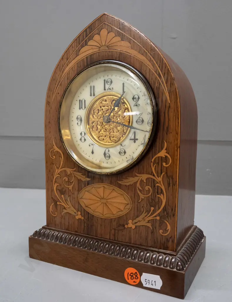 vintage mantel clock in arched rosewood case with boxwood and harewood stringing and inlays, porcelain face with pierced Image 1++