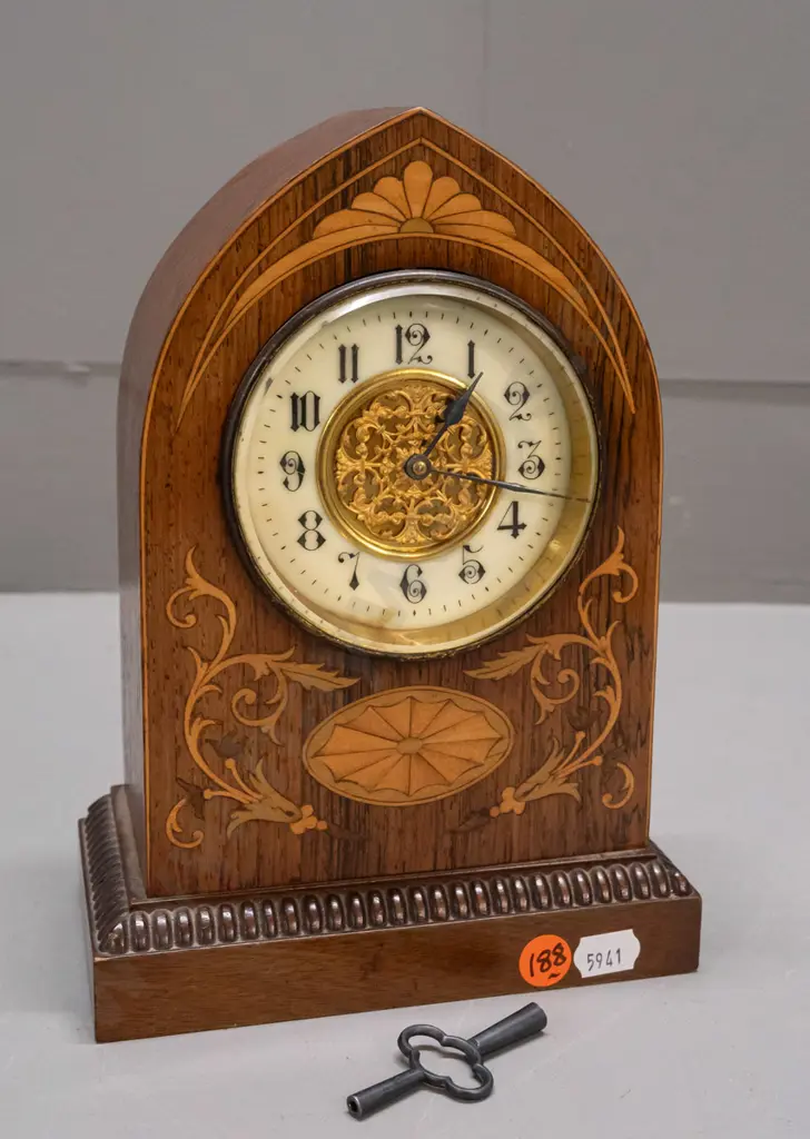 vintage mantel clock in arched rosewood case with boxwood and harewood stringing and inlays, porcelain face with pierced Image 1++