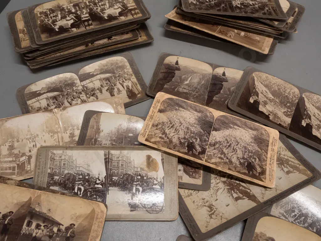 Underwood & Underwood stereoscope viewer and numerous cards including Boer War scenes, European cities, novelty parlour Image 1++