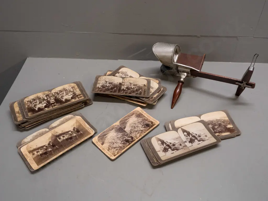 Underwood & Underwood stereoscope viewer and numerous cards including Boer War scenes, European cities, novelty parlour Image 1++