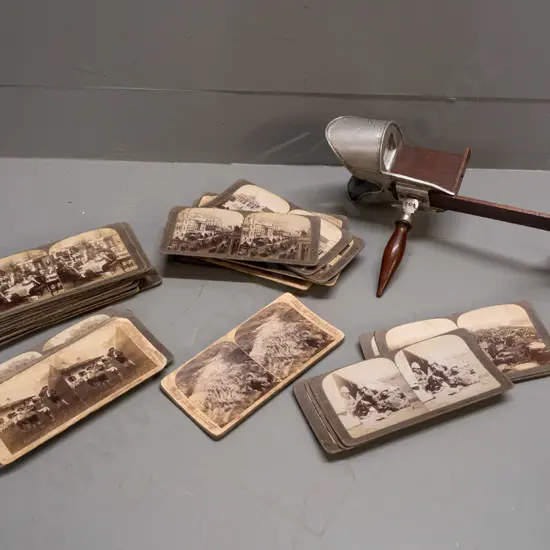 Underwood & Underwood stereoscope viewer and numerous cards including Boer War scenes, European cities, novelty parlour