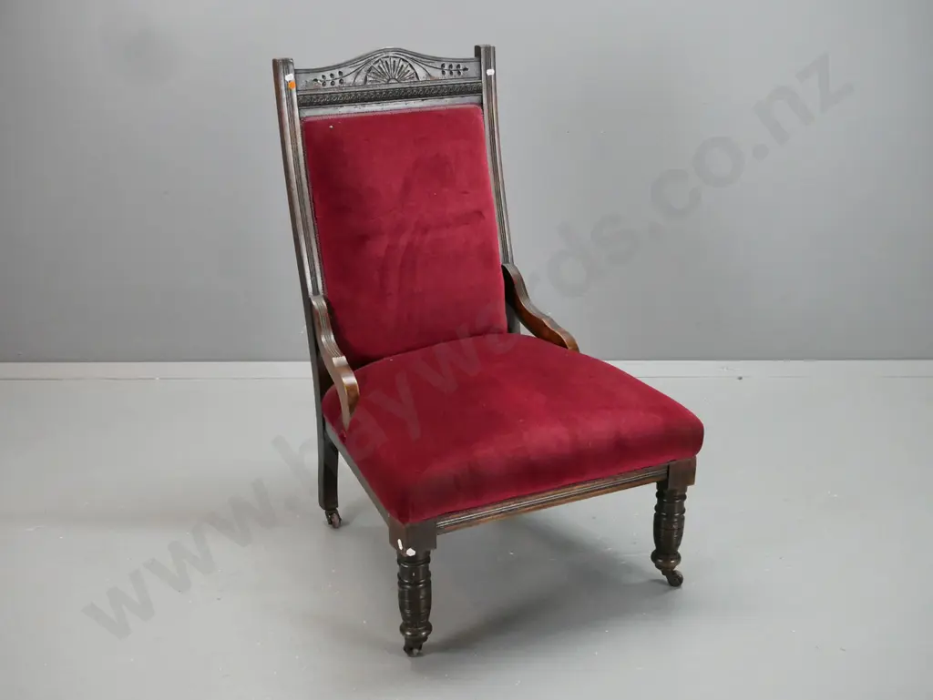 Edwardian beech fireside chair carved crest top rail, pressed swirling coin decoration, turned front legs on porcelain Image 1++