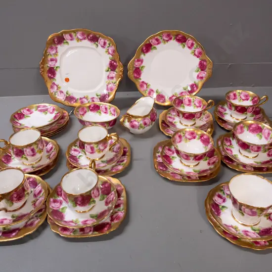 Royal Albert heavily gilded Old English Rose tea ware: 9 trios in 3 shapes, cream, sugar, 2 cake plates, 2 spare saucers