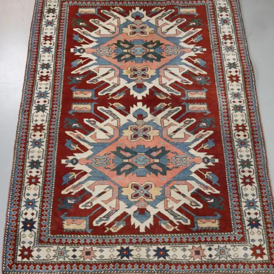 tribal style hand woven wool floor mat - geometric pattern, dark red, pink, blue and cream - some stains and fading,