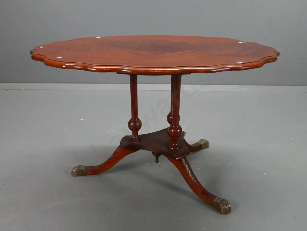 reproduction side table with figured mahogany top with shaped edge, 3-leg cathedral style platform base with brass lion Image 1++