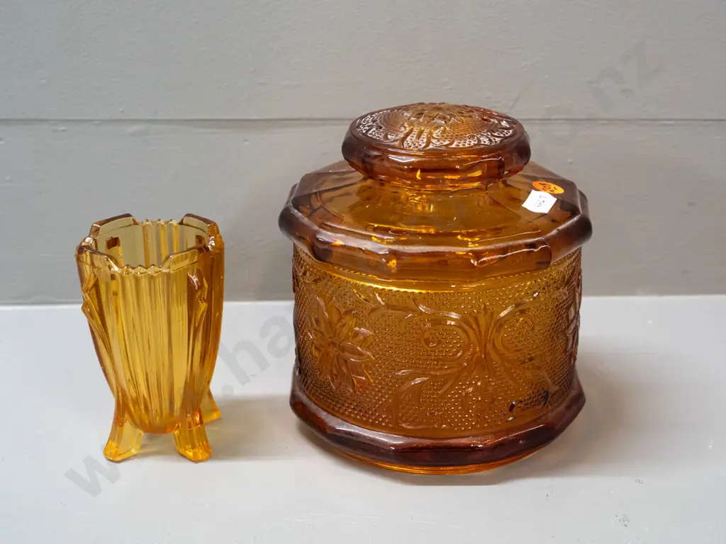 2 pieces of moulded amber glass - large lidded canister H-150 D-130 and a small deco spill vase marked Made in England Image 1++