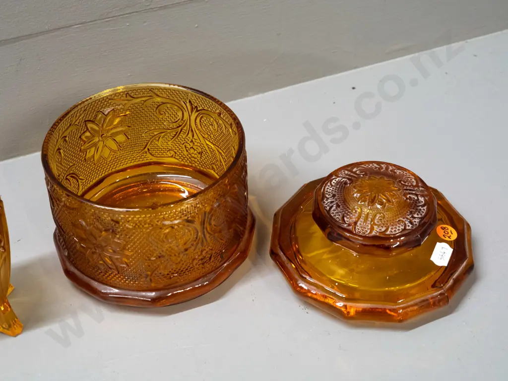 2 pieces of moulded amber glass - large lidded canister H-150 D-130 and a small deco spill vase marked Made in England Image 1++