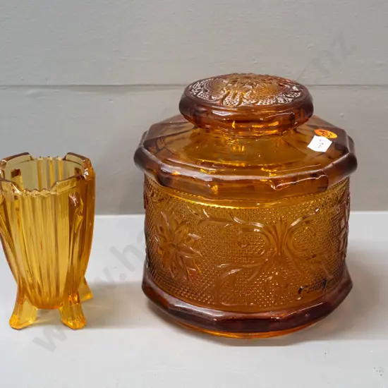 2 pieces of moulded amber glass - large lidded canister H-150 D-130 and a small deco spill vase marked Made in England