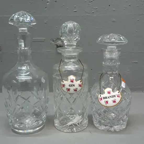 3 cut crystal stoppered decanters and 2 Royal Adderley / Ridgway "Gin" and "Brandy" porcelain labels - tallest is H-290