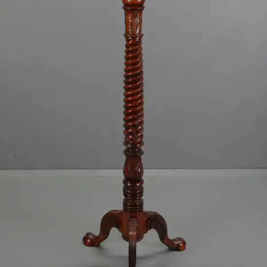 traditional style Indonesian mahogany twist column and foliate carved torchiere or plant stand with 3 carved legs on