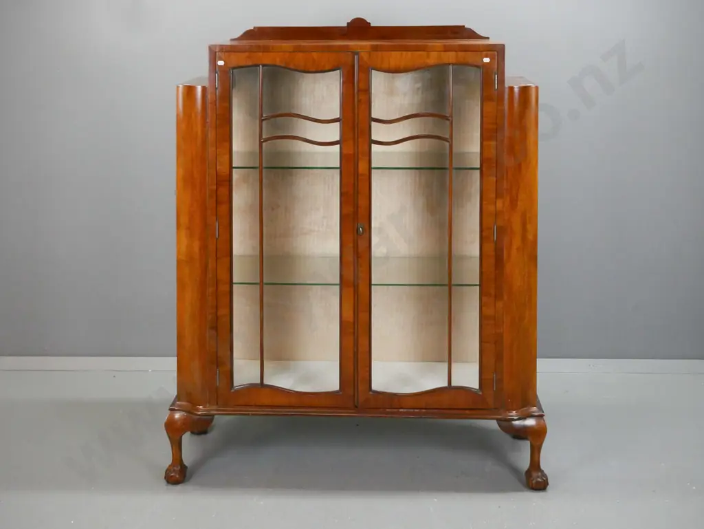 vintage walnut Art Nouveau-style display case w/ stepped top, 2 shaped glazed doors w/ beaded shaped astragal, glazed Image 1++