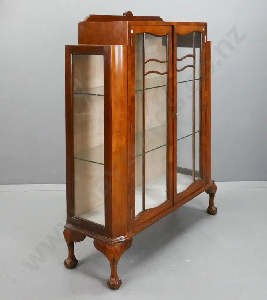 vintage walnut Art Nouveau-style display case w/ stepped top, 2 shaped glazed doors w/ beaded shaped astragal, glazed Image 1++
